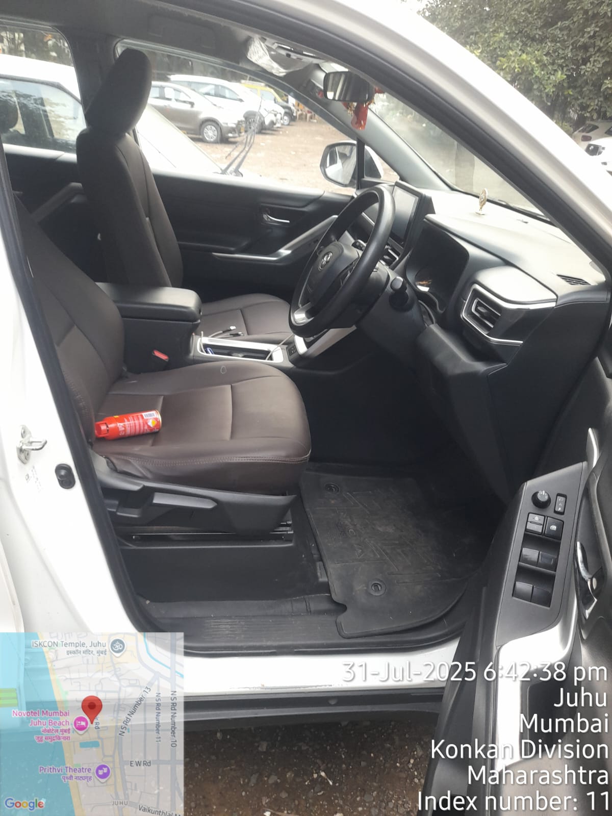 Innova Crysta driver cabin with steering, touchscreen and brown seats
